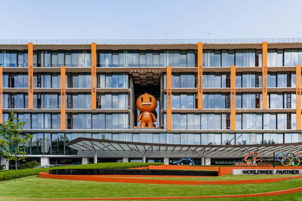 a large building with a giant orange object in the middle of it