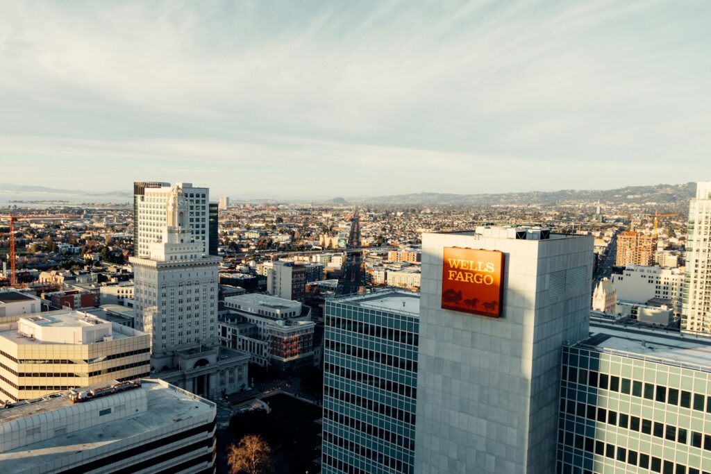 city buildings under white sky during daytime, Wells Fargo Stock