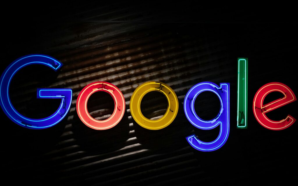 Google logo neon light signage, alphabet shares