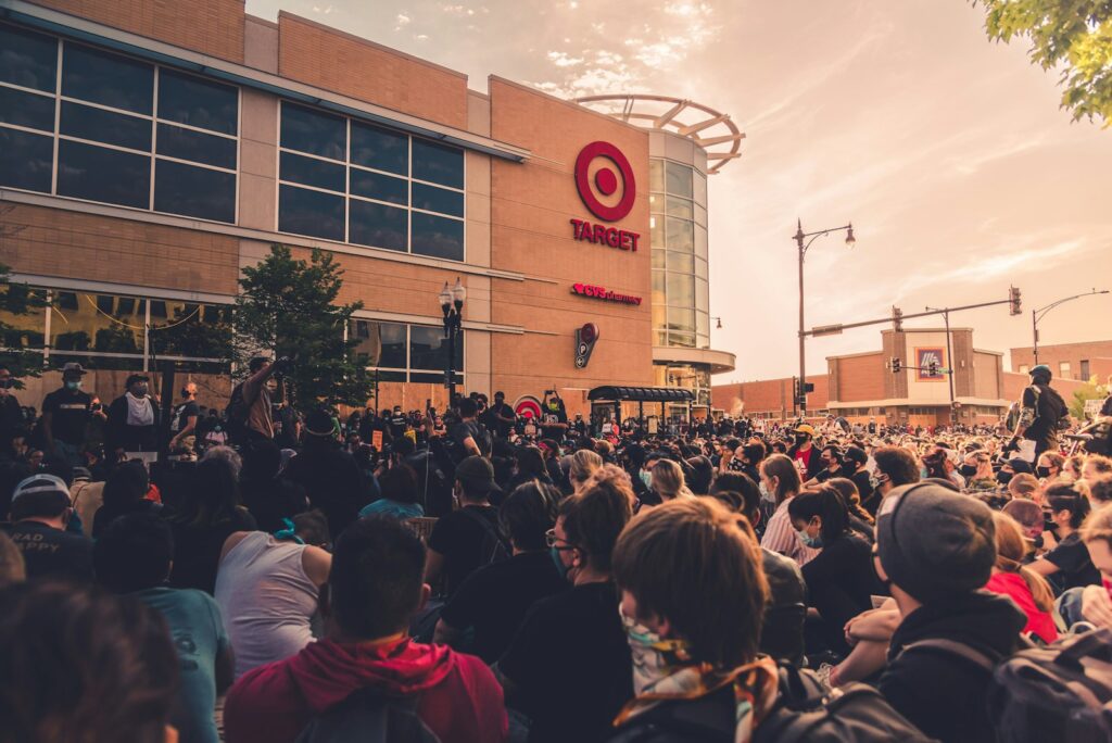 target stock forecast, people gathering in front of brown building during daytime